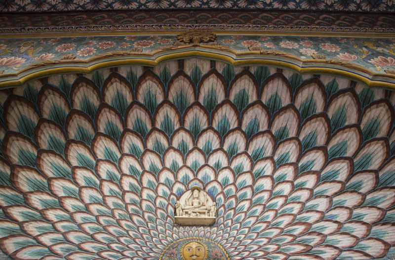 Low angle view of ornate ceiling in temple