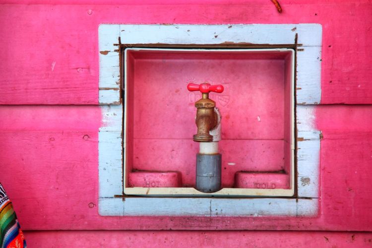 Close-up of fire hydrant against building