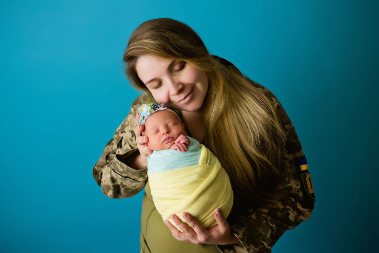 Ukrainian military woman with baby