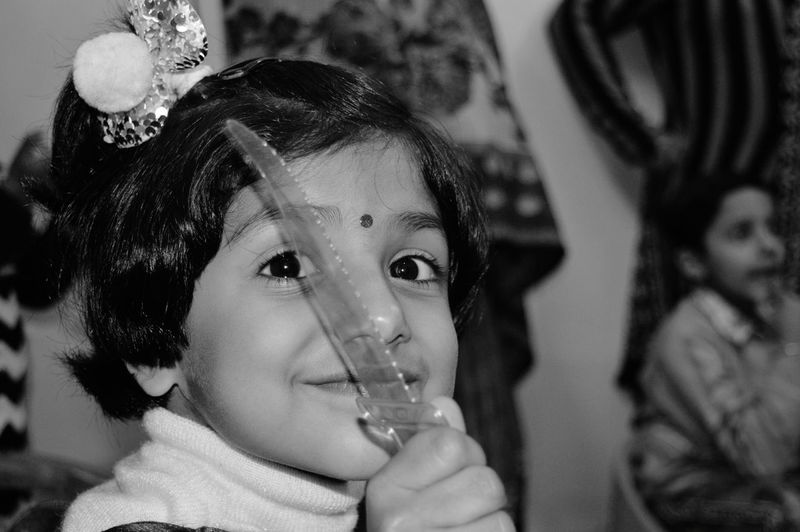 Close-up portrait of a girl drinking