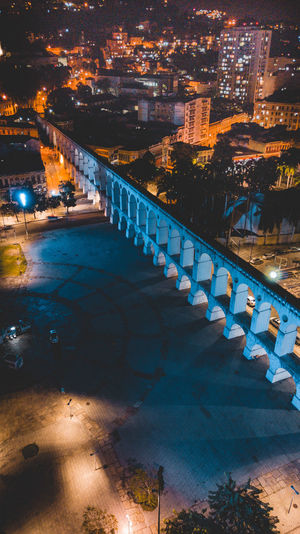 High angle view of illuminated bridge in city at night