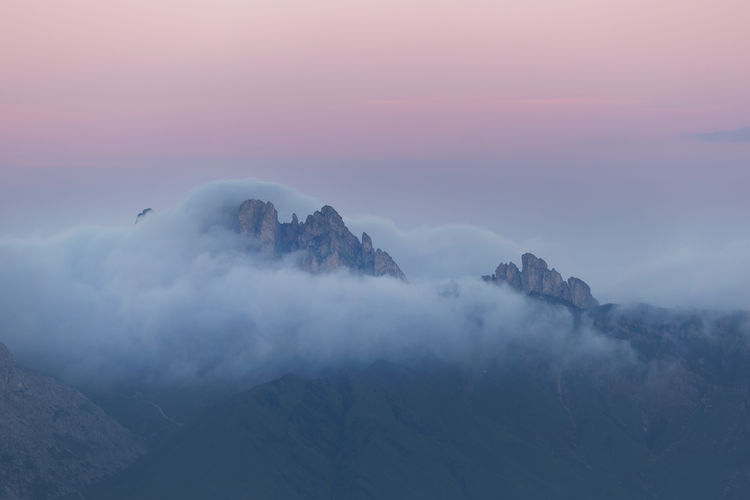 Scenic view of mountains against sky during sunset