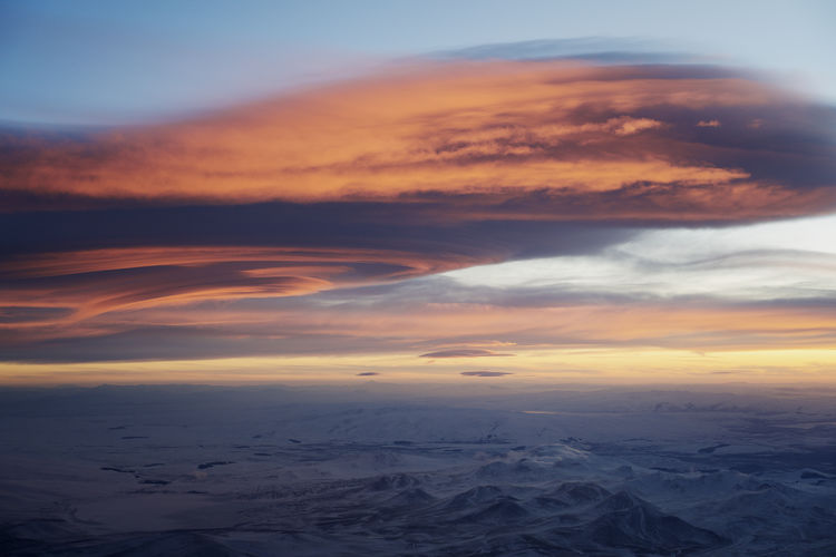 Aerial view of clouds over sea during sunset