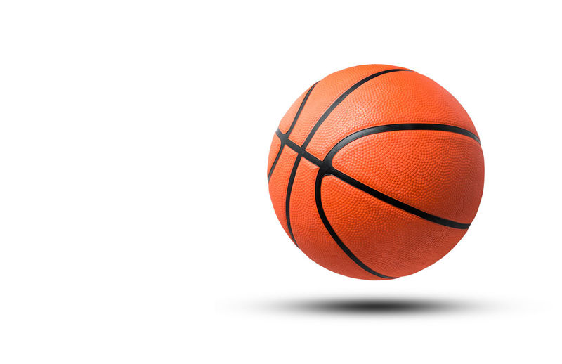 Close-up of basketball hoop against white background