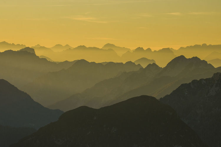 Sunset on mangart ridge in the julian alps of slovenia with beautiful sights on mountain ridges
