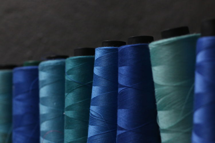 Sewing thread. blue thread.