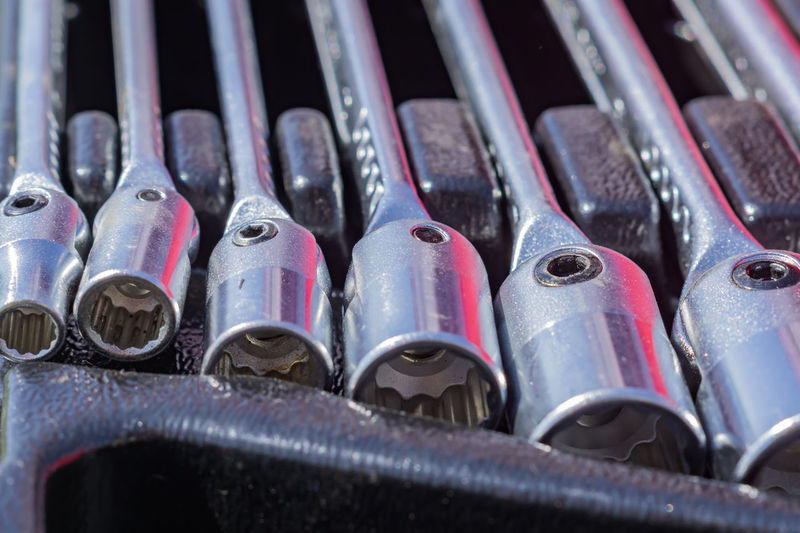 Set of socket wrenches in a case, close up of workers tools, selective focus