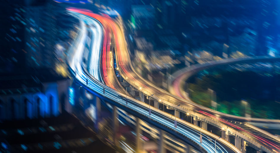 Blurred motion of highway against sky in city