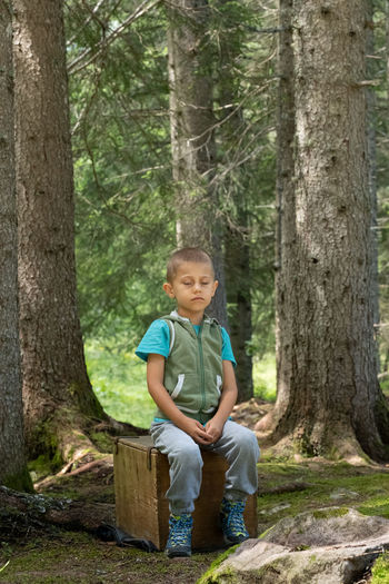 Full length of boy in forest
