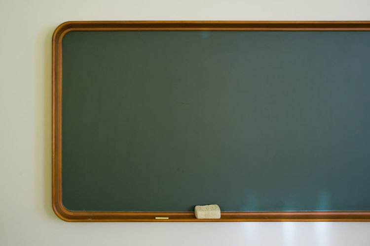 Close up of blackboard mounted on wall