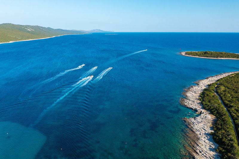 Aerial view of a beach with the boats on the sakarun beach, adriatic sea, croatia