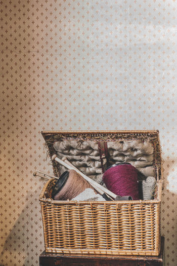 Close-up of wicker basket on wall at home