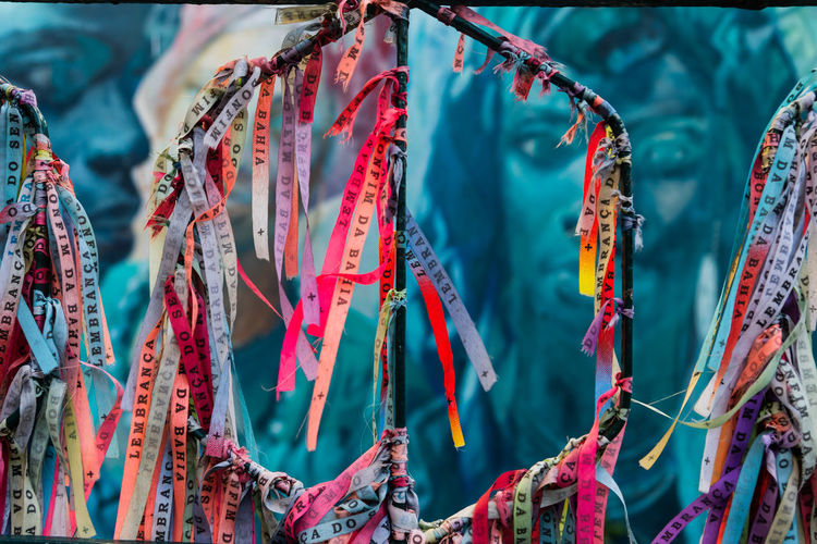 Colored ribbons of senhor do bonfim tied to an iron gate in pelourinho.