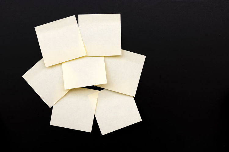 High angle view of paper over black background