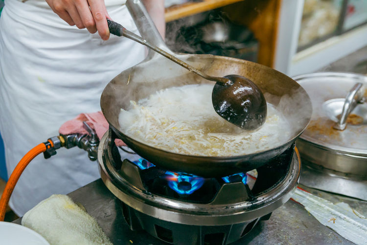Cropped image of man preparing food