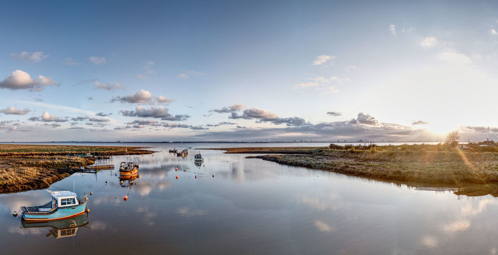 Sunset over boats in stone creek harbour, sunk island, east riding of yorkshire, uk
