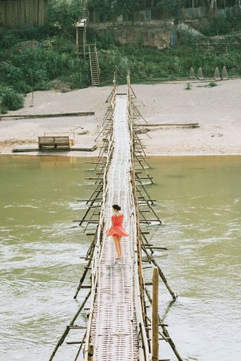 High angle view of man on pier over river
