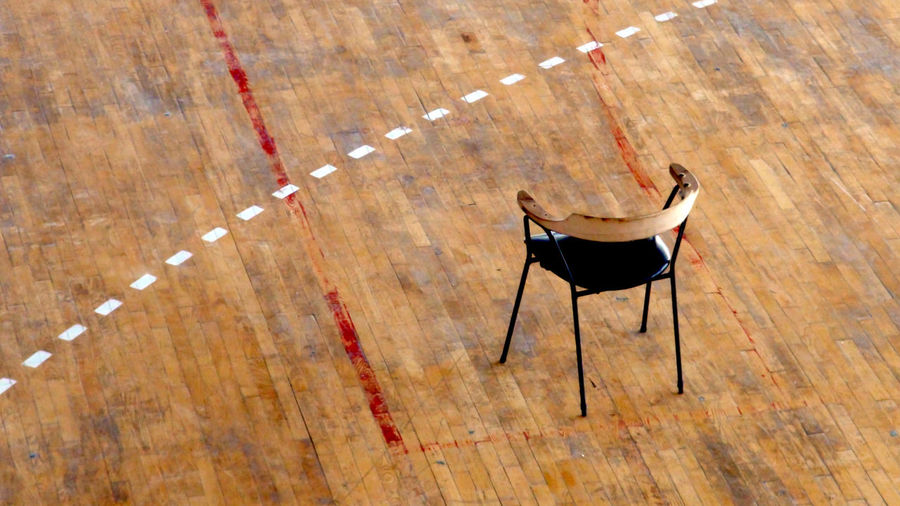 High angle view of chair on hardwood floor