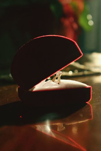 Close-up of ring in box on table