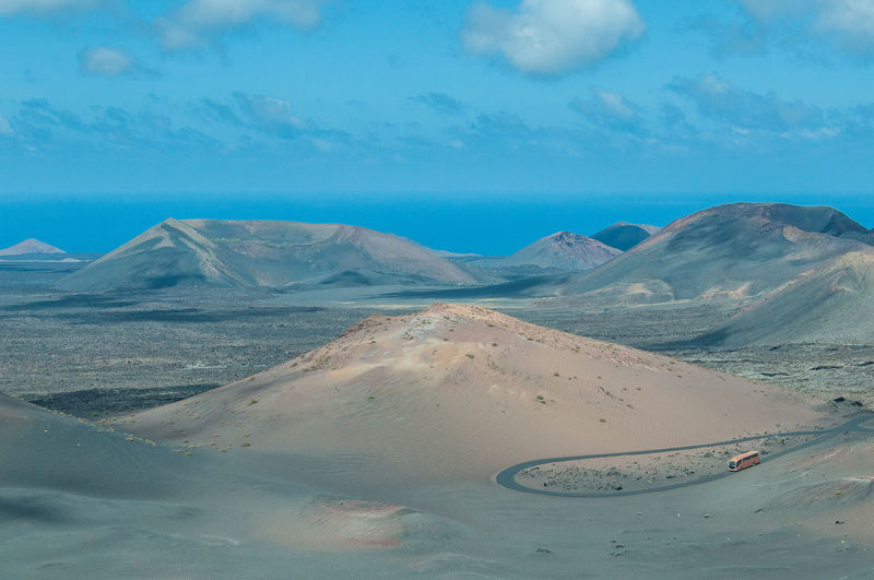 Scenic view of road at desert against sky