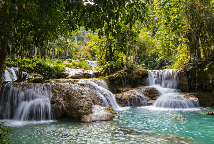 Kuang si or kunag xi waterfalls close to luang prabang in laos