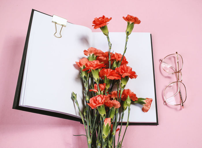 Flowers on pink background with accesories