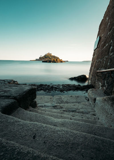 Scenic view of sea against clear sky st michaels mount cornwall