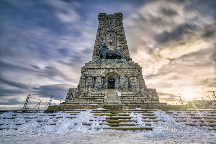 Shipka monument is historic building against sky during winter