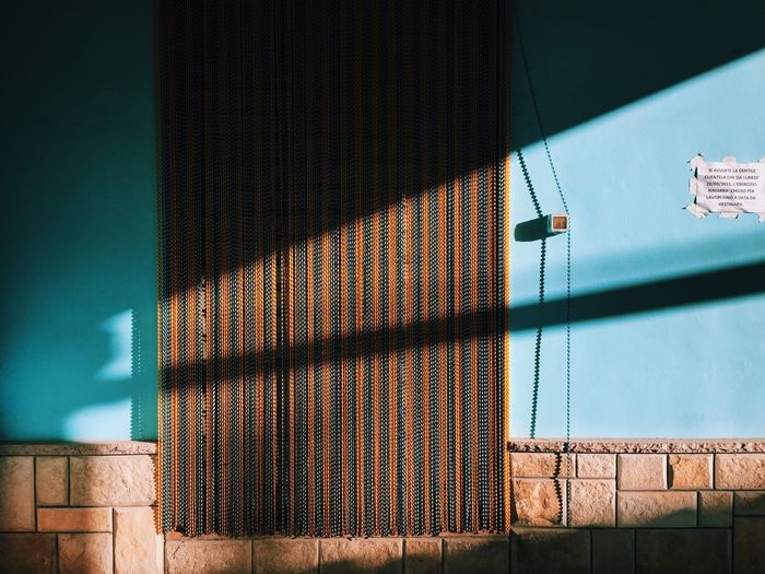 Close-up of curtained against the wall