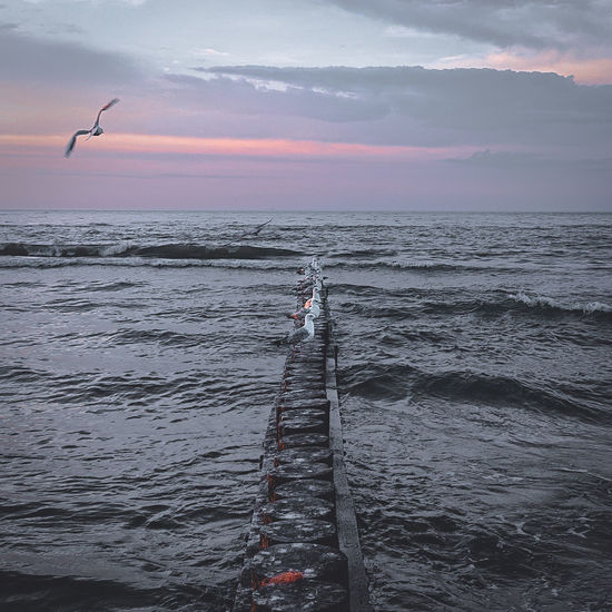 Scenic view of sea against sky during sunset