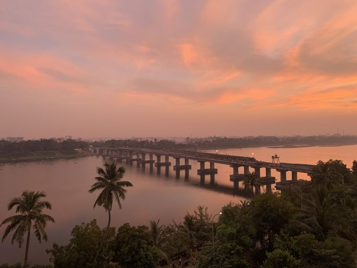 Scenic view of bridge against sky during sunset