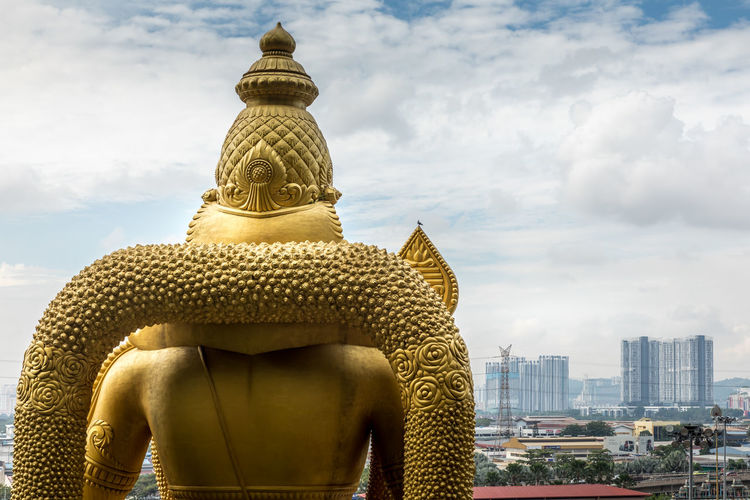 Golden buddha overlooking kuala lumpur 