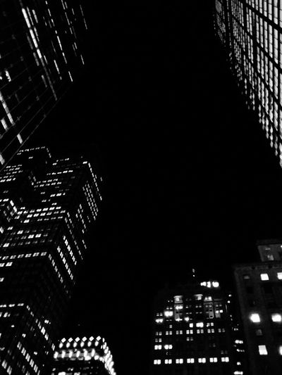 Low angle view of modern building at night