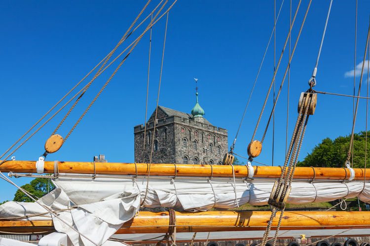 Rosenkrantz tower sticking up above the boom of the boat, bergen, norway