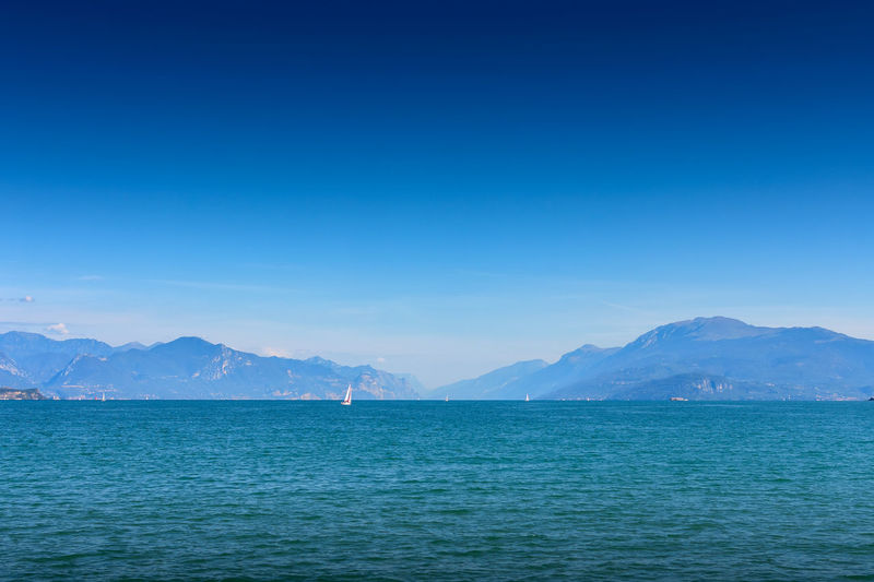 Scenic view of sea against blue sky