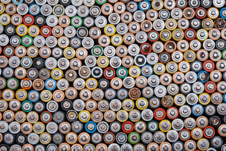 Used batteries from different manufacturers,  collection and recycling, danger for the environment. 