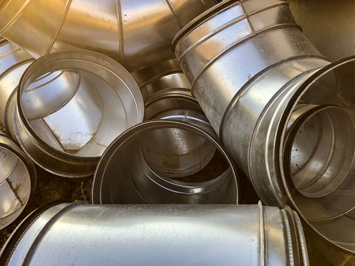 Halvanized ventilation pipe elbows. industrial metal pipes.