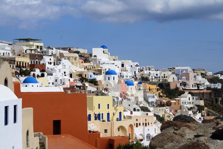 Low angle view of town against blue sky