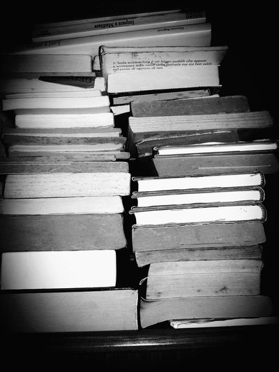Close-up of stacked books on table