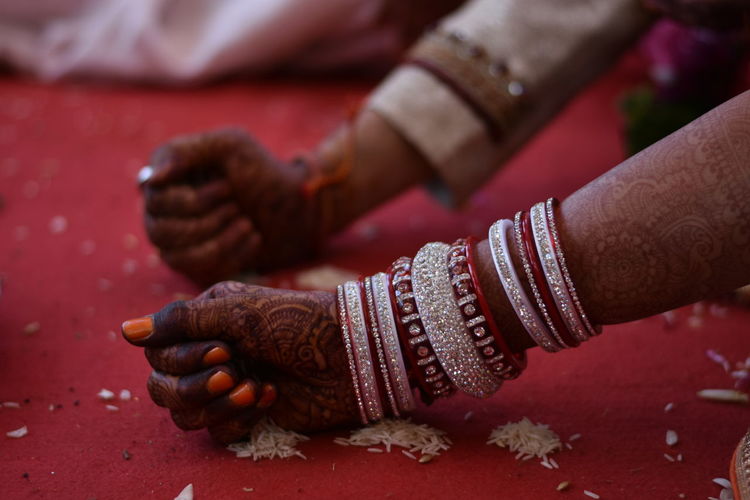Cropped image of bride and broom hands during wedding