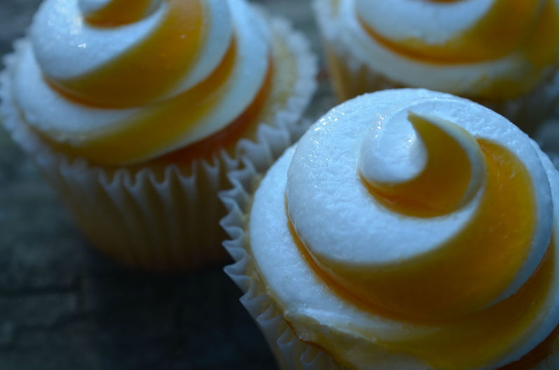 Close-up of mango cupcakes on table