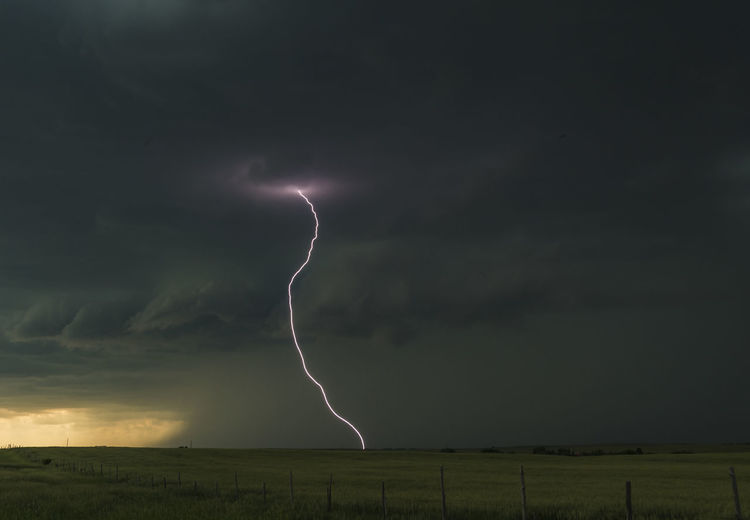 Low angle view of lightning at dusk