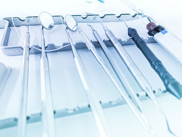 Close-up of dental equipment against white background