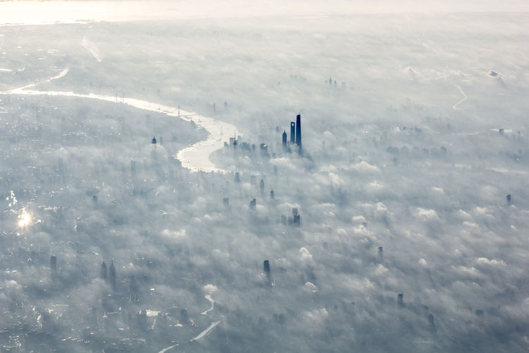 Aerial view of cityscape during foggy weather