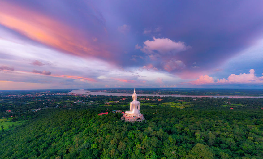 Top view aerial photo, big buddha wat phu manorom mukdahan province, thailand.