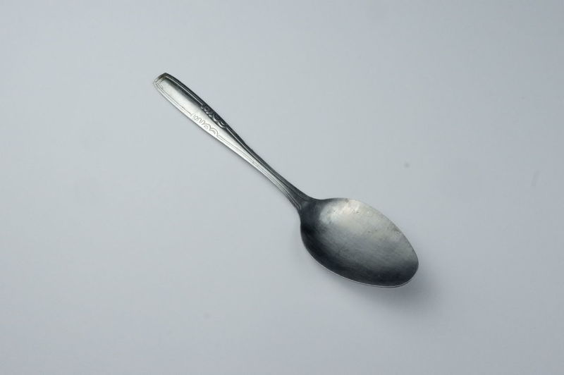 High angle view of fork over white background