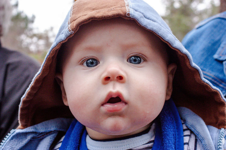 Portrait of cute baby boy outdoors