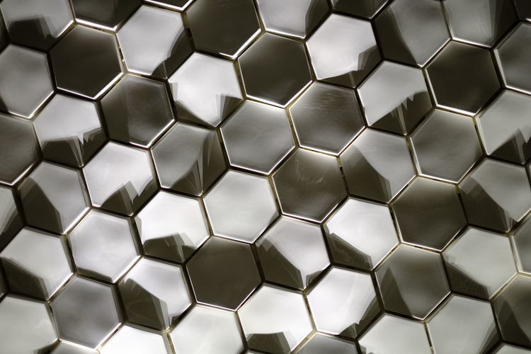 Full frame shot of patterned shiny hexagonal tiles