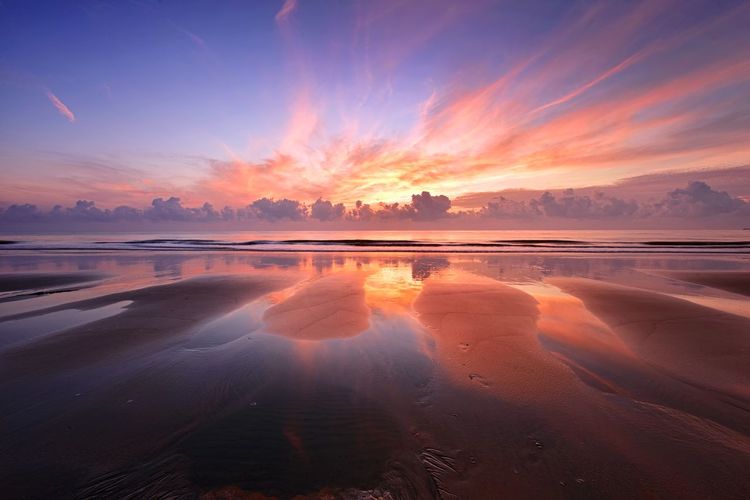 Sunset reflections on the beach