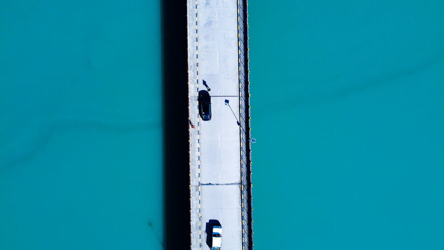 High angle view of cars over bridge on river